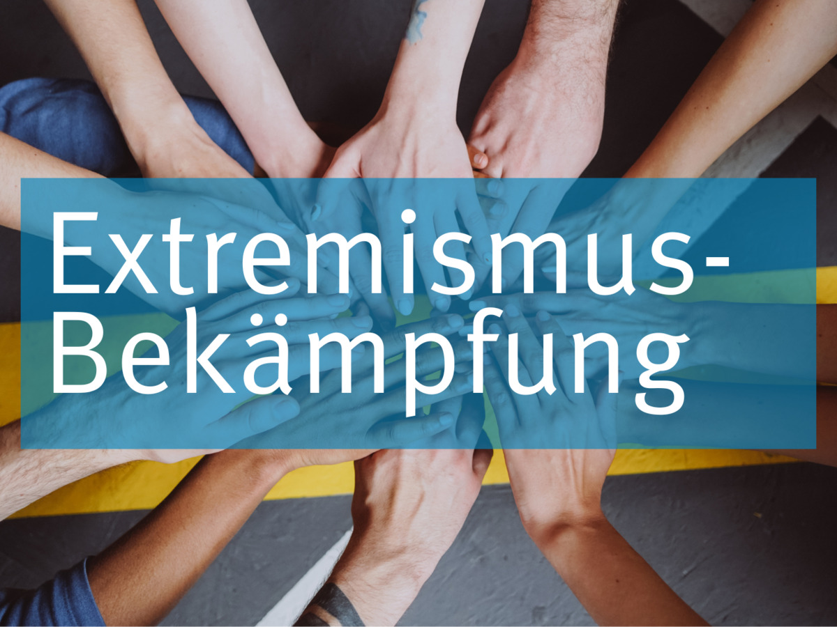 Symbolbild Extremismus-Bekämpfung: Viele Hände, die alle in die Mitte zeigen, um Gemeinsamkeit zu symbolisieren.